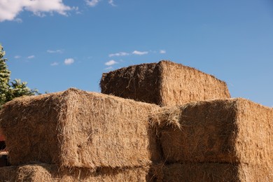 Photo of Bales of hay outdoors on sunny day, closeup