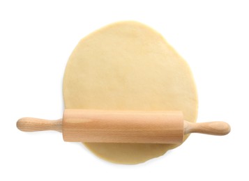 Cooking homemade pie. Raw dough and wooden rolling pin isolated on white, top view