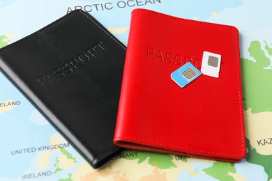 Photo of Passports and SIM cards on world map