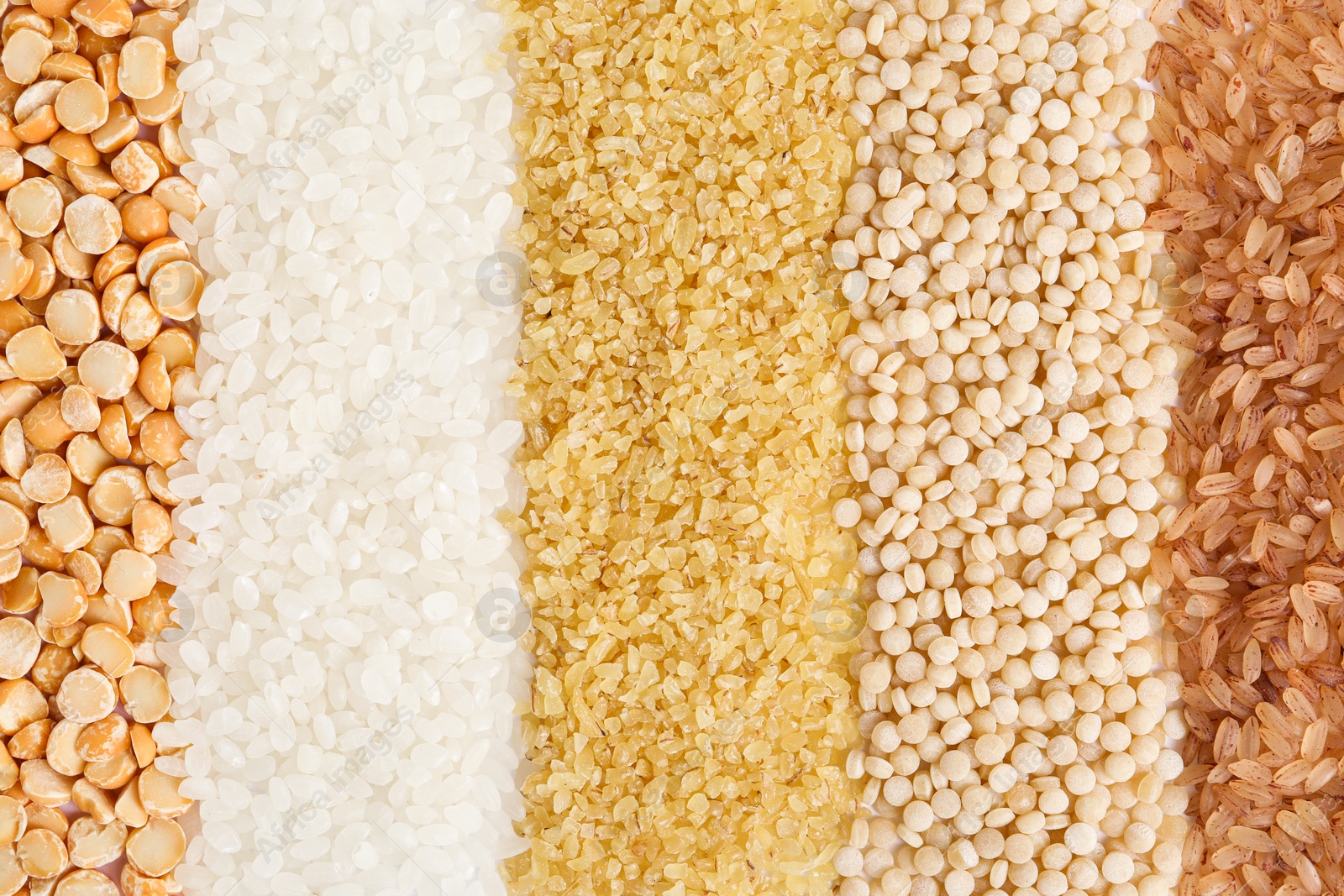 Photo of Different cereal grains as background, top view