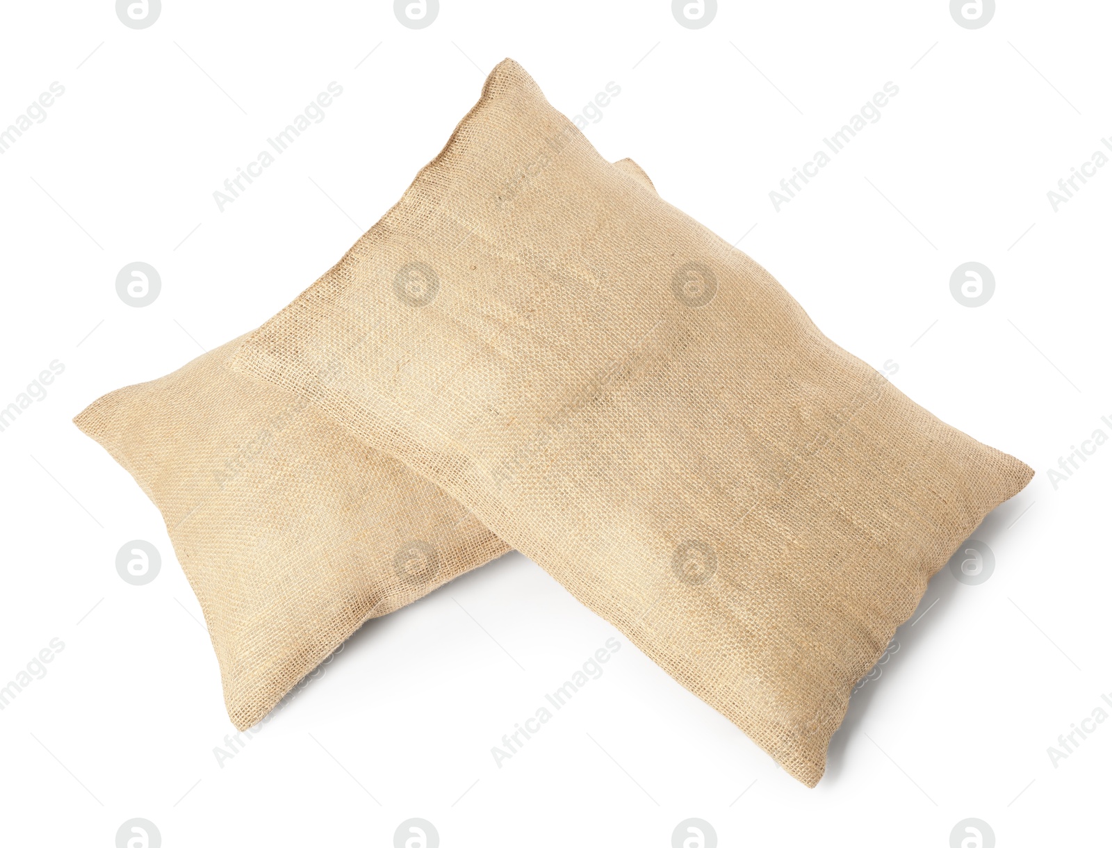 Photo of Two burlap sacks isolated on white, top view