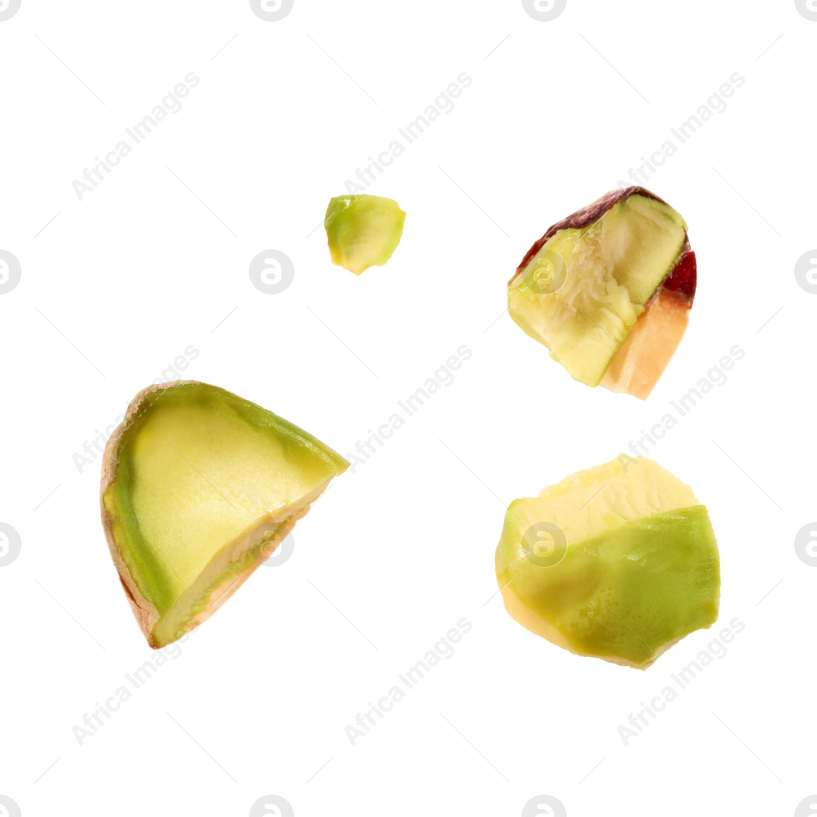 Photo of Pieces of peeled pistachio nut isolated on white