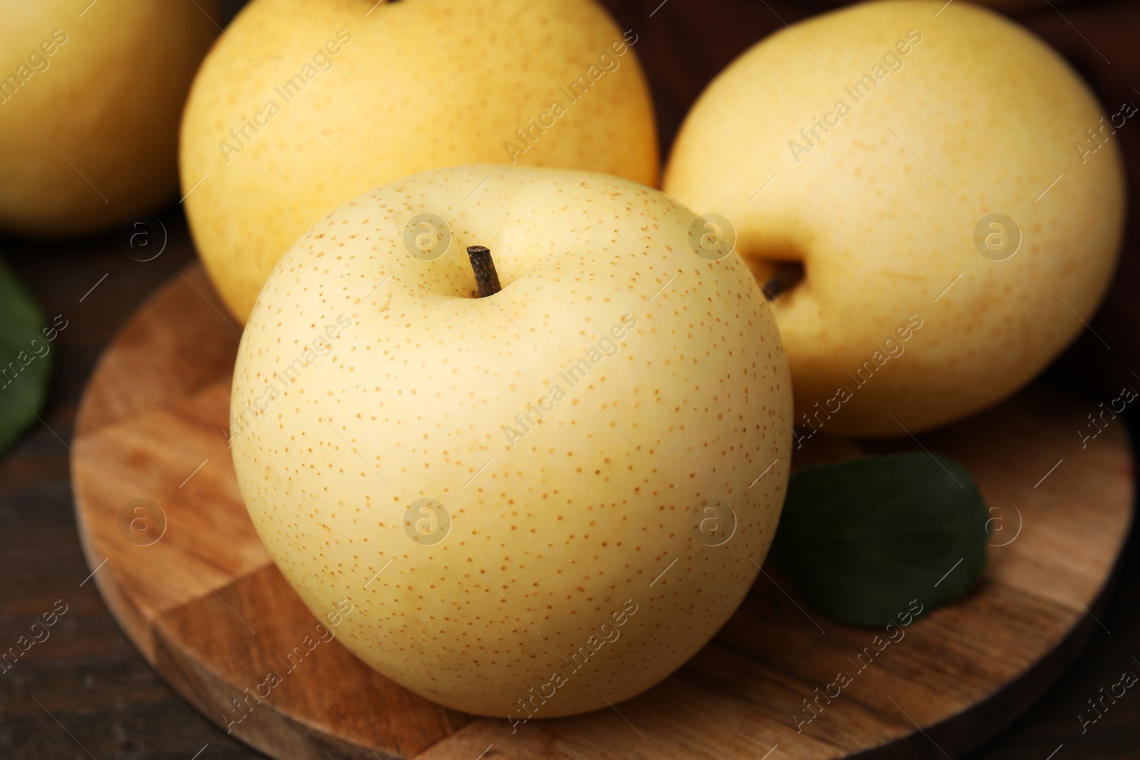 Photo of Delicious fresh apple pears on table, closeup