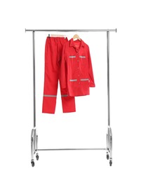 Photo of Paramedic uniform on clothing rack against white background