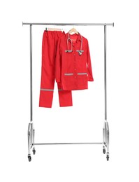 Photo of Paramedic uniform with stethoscope on clothing rack against white background