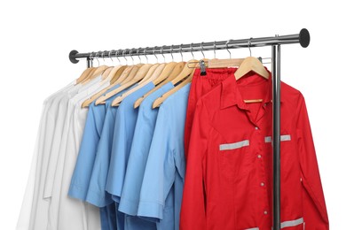 Photo of Different medical workers' uniforms on clothing rack against white background