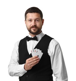 Professional croupier with playing cards on white background