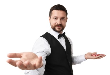 Croupier with casino chips on white background