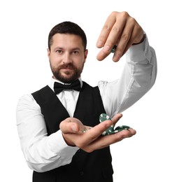 Croupier with casino chips on white background