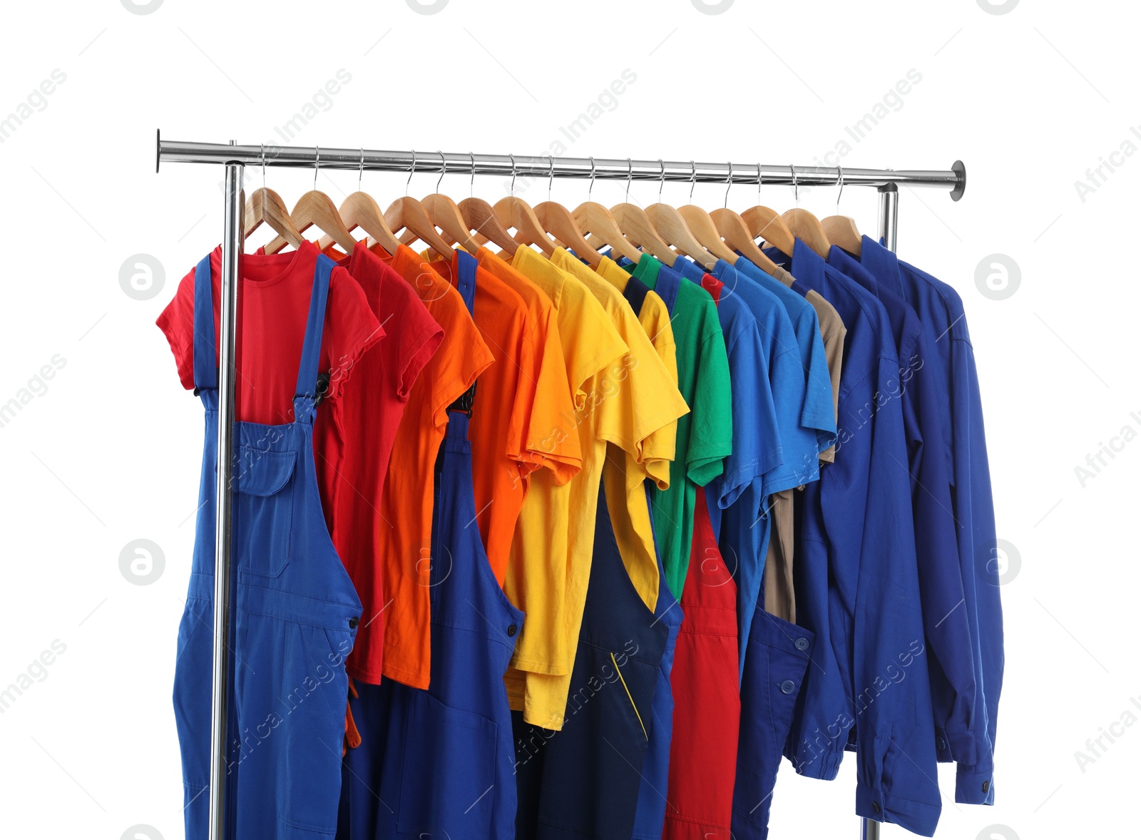 Photo of Different workers' uniforms on clothing rack isolated on white