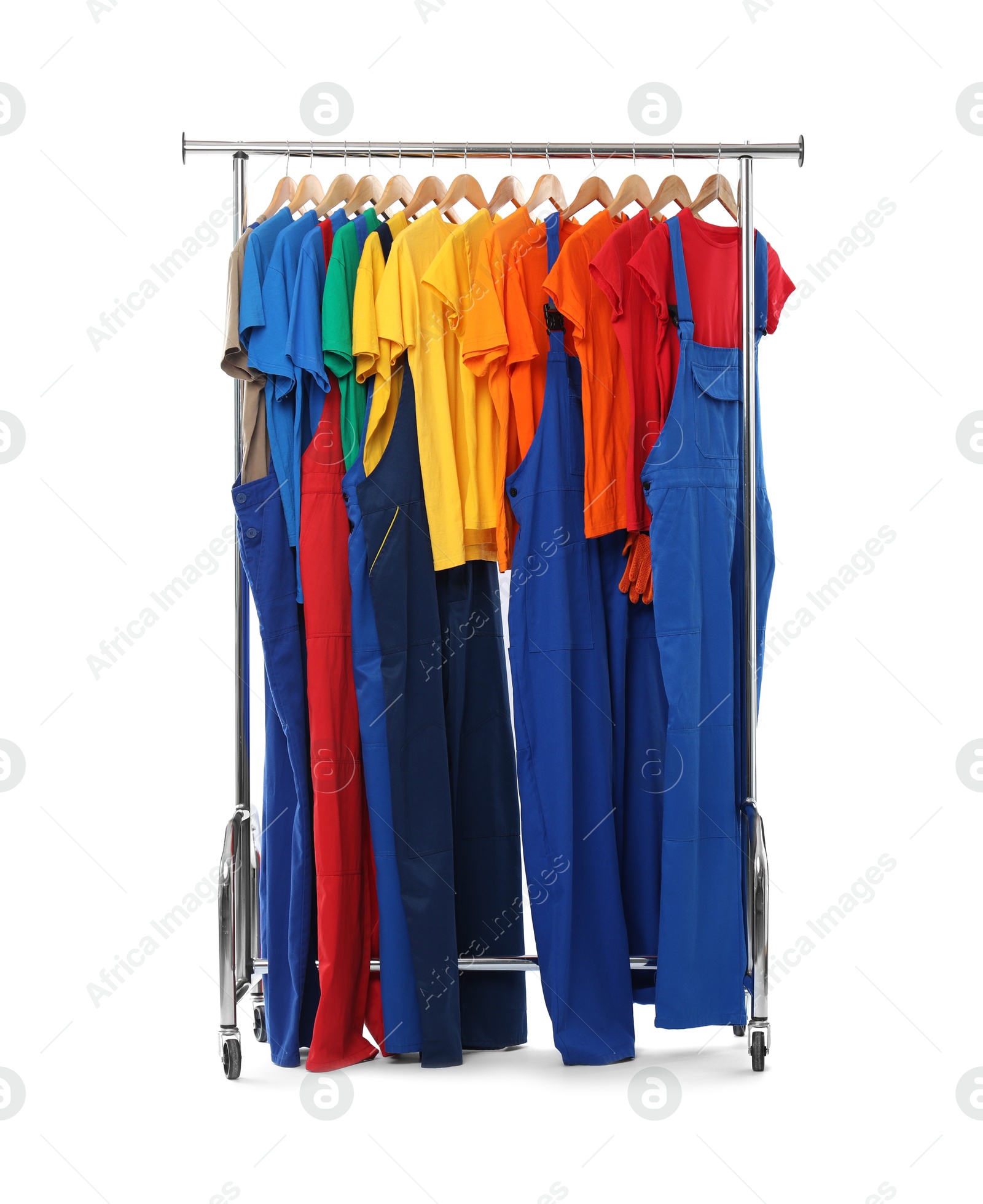 Photo of Different workers' uniforms on clothing rack isolated on white