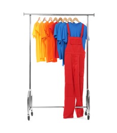 Photo of Worker's uniform and t-shirts on clothing rack isolated on white