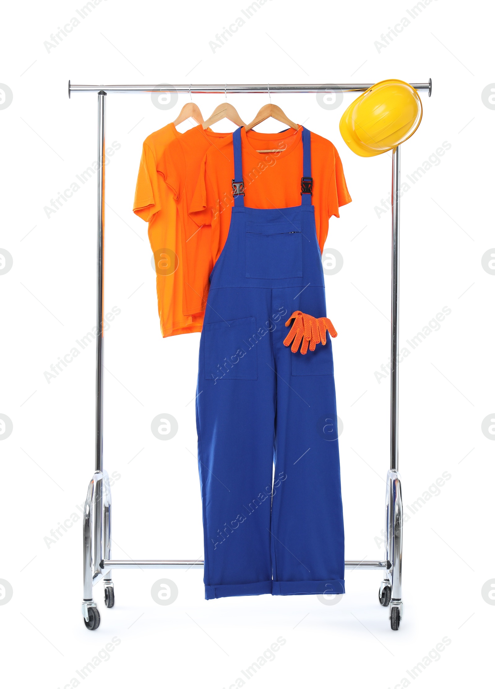 Photo of Worker's uniform and t-shirts on clothing rack isolated on white