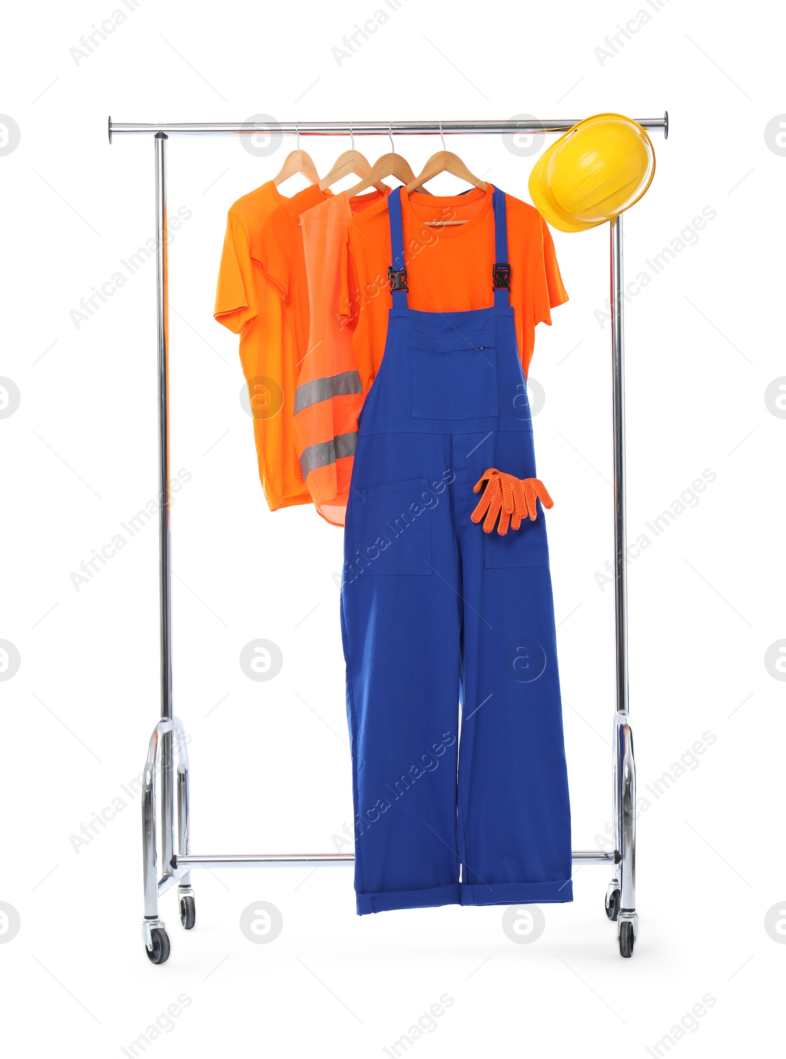 Photo of Worker's uniform and t-shirts on clothing rack isolated on white