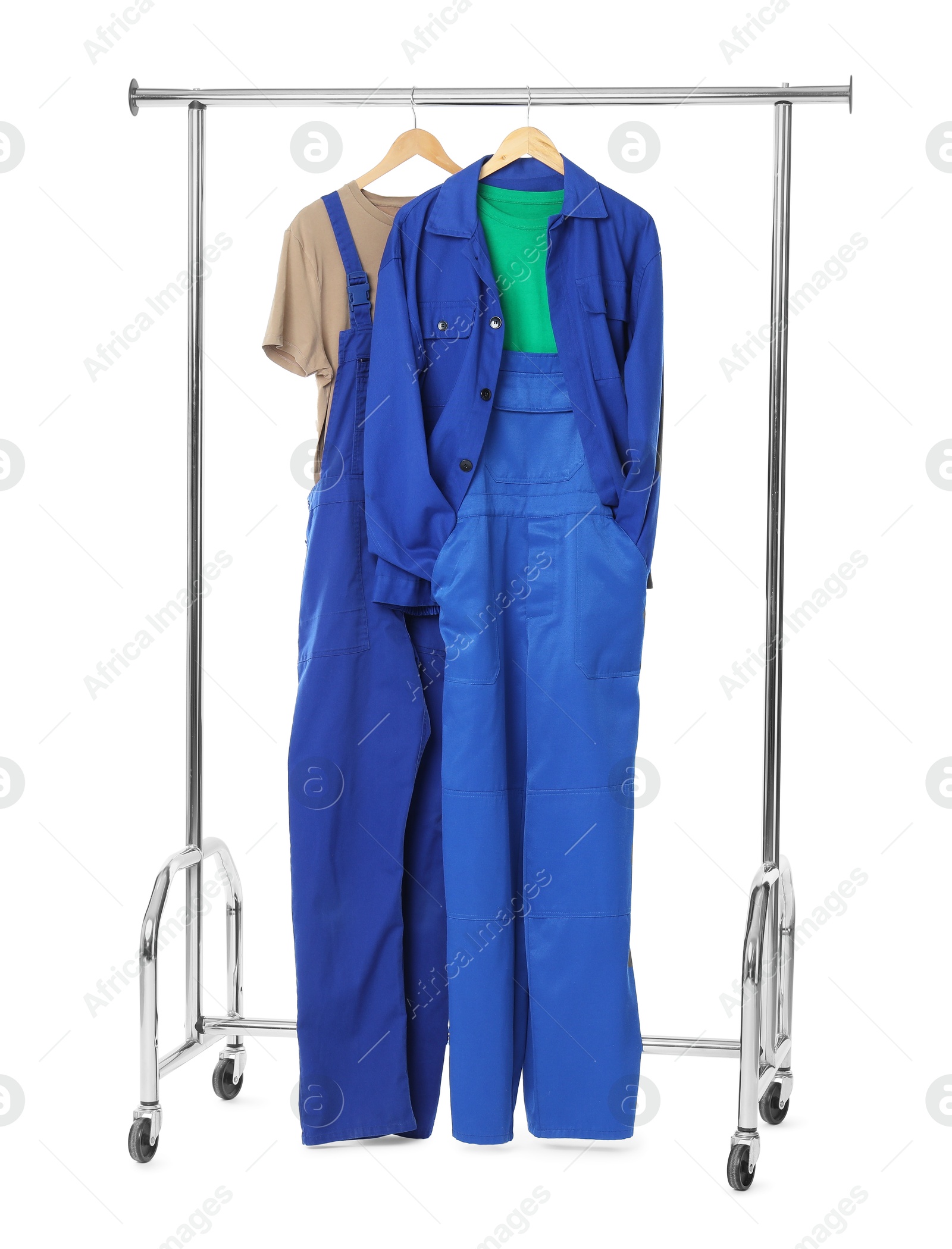 Photo of Workers' uniforms on clothing rack isolated on white