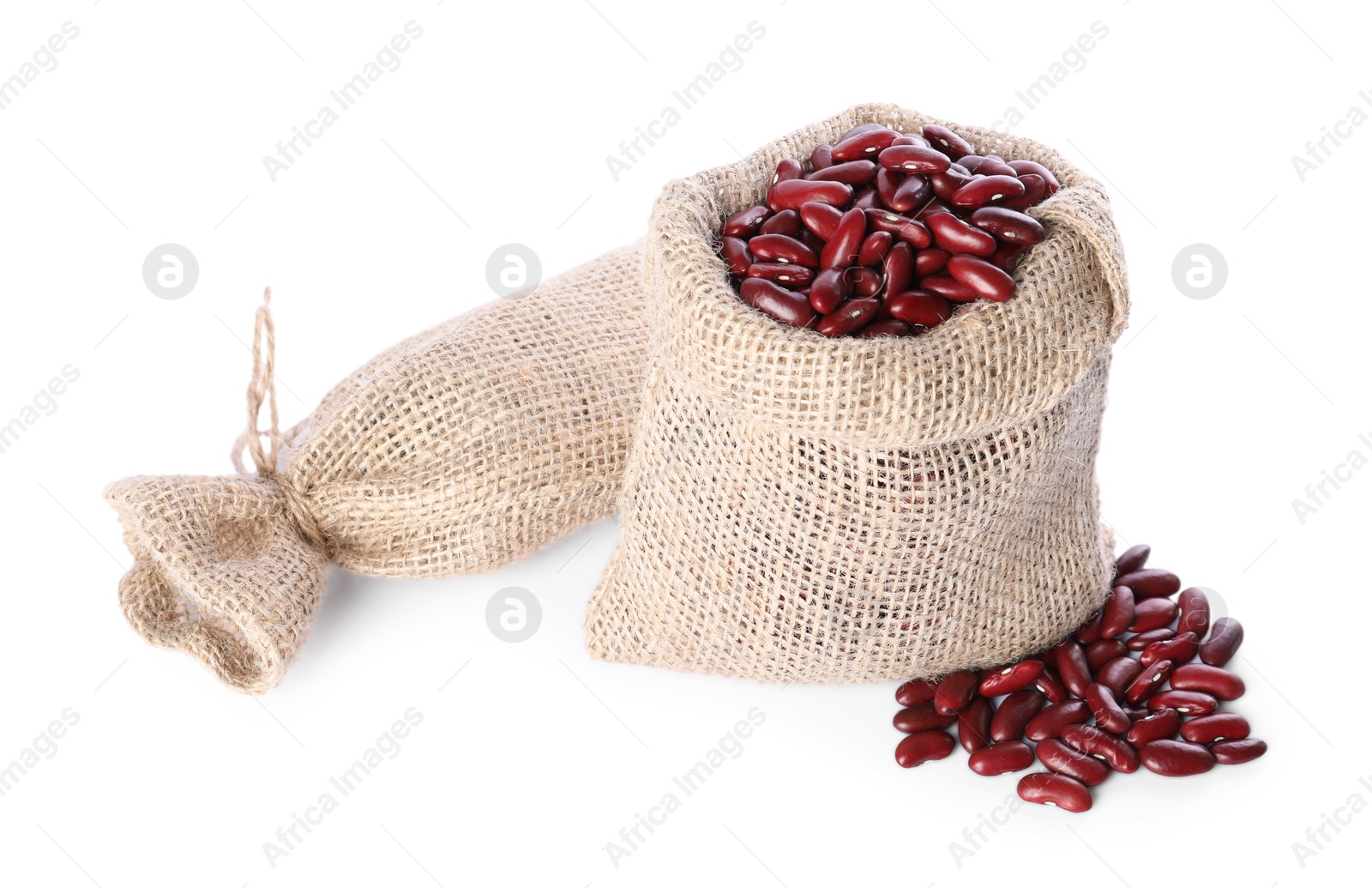 Photo of Burlap sacks with dried red beans isolated on white