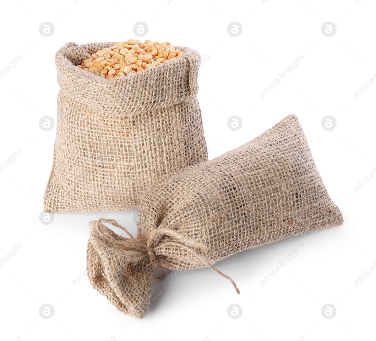 Photo of Burlap sacks with dried peas isolated on white, top view