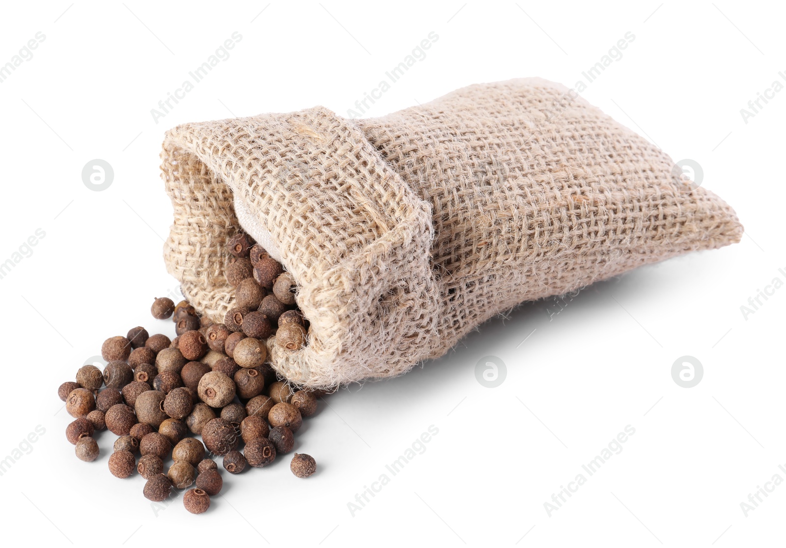 Photo of Burlap sack with allspice isolated on white