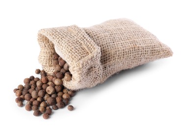 Photo of Burlap sack with allspice isolated on white