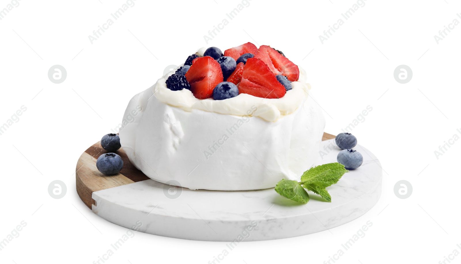 Photo of Pavlova cake (meringue dessert) with whipped cream, fresh berries and mint isolated on white