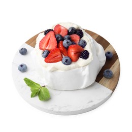 Photo of Pavlova cake (meringue dessert) with whipped cream, fresh berries and mint isolated on white