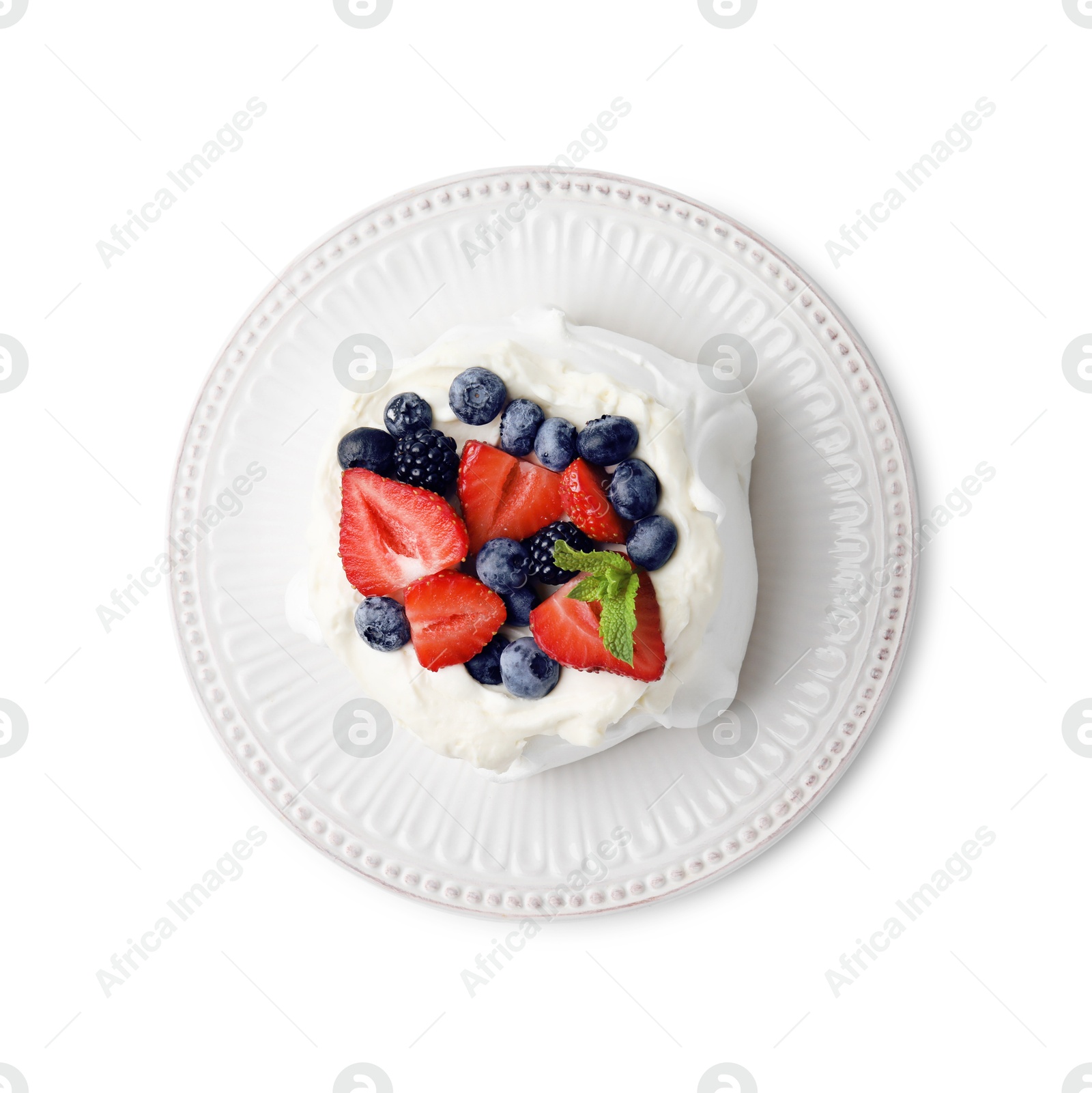 Photo of Pavlova cake (meringue dessert) with whipped cream, fresh berries and mint isolated on white, top view