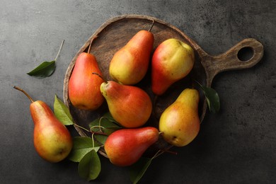 Photo of Ripe juicy pears on grey table, flat lay