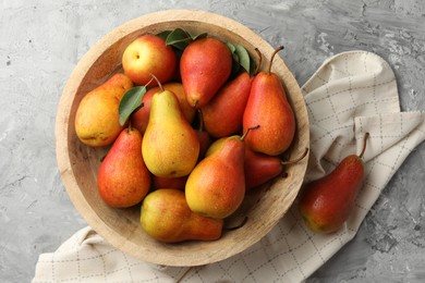 Photo of Ripe juicy pears on grey table, top view