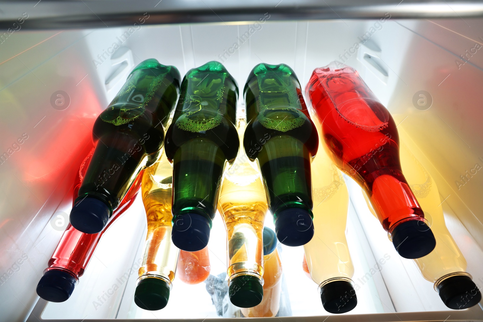 Photo of Many different cold drinks in refrigerator, closeup