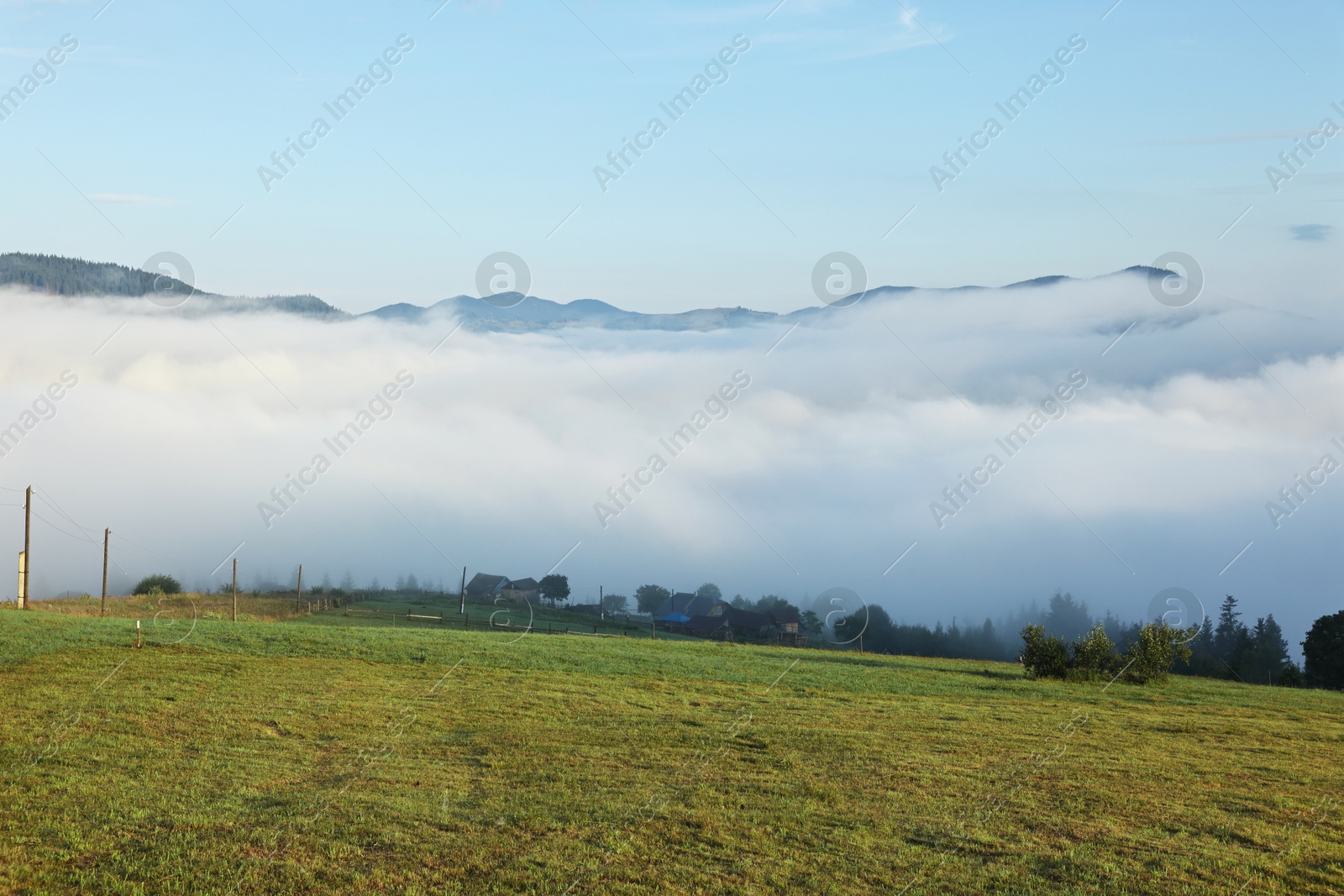 Photo of Beautiful mountains covered with fog in morning