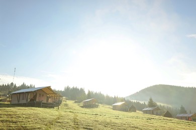 Many houses and beautiful mountains covered with fog in morning