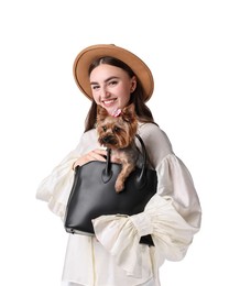 Photo of Beautiful young woman holding bag with cute Yorkshire Terrier dog isolated on white