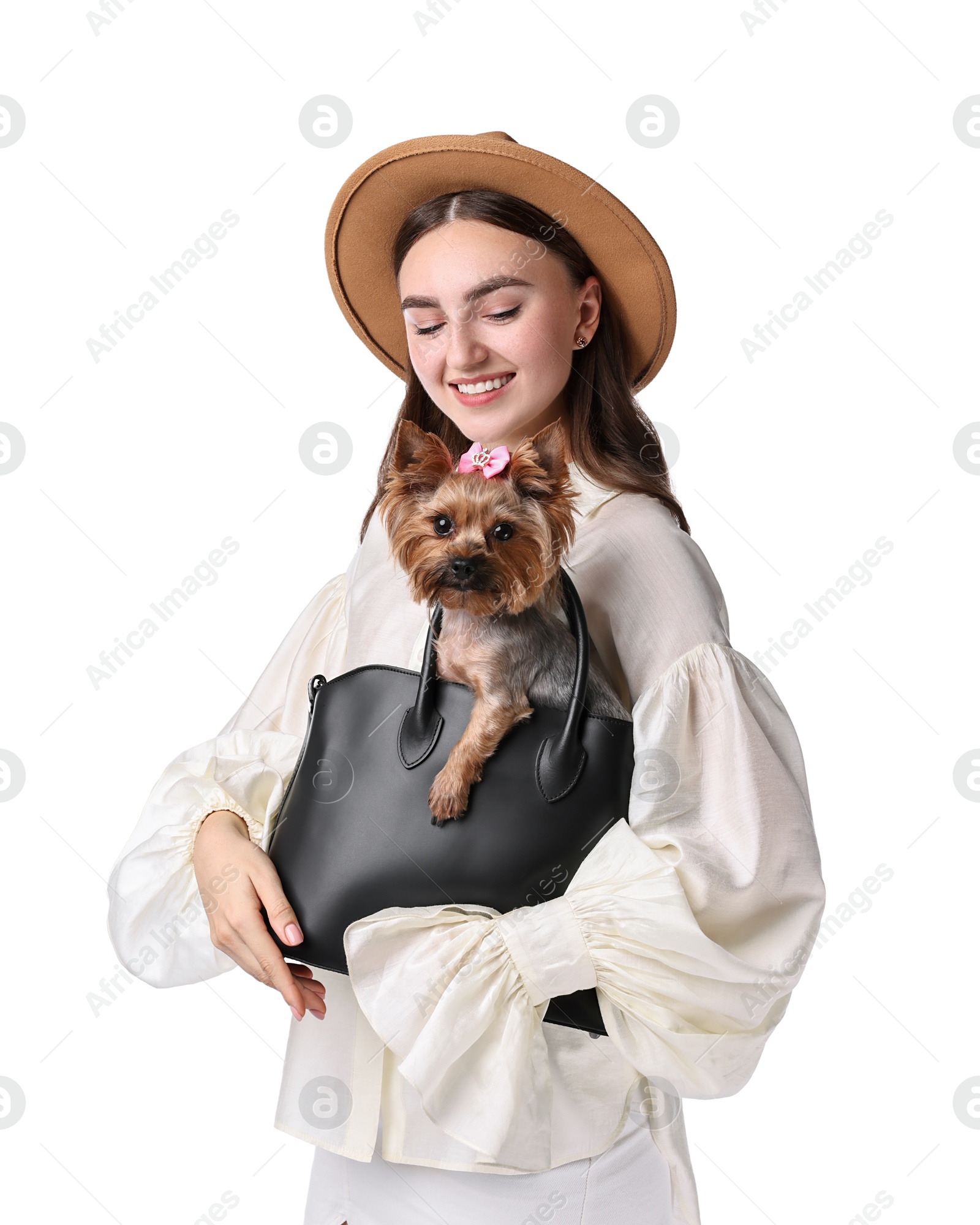 Photo of Beautiful young woman holding bag with cute Yorkshire Terrier dog isolated on white