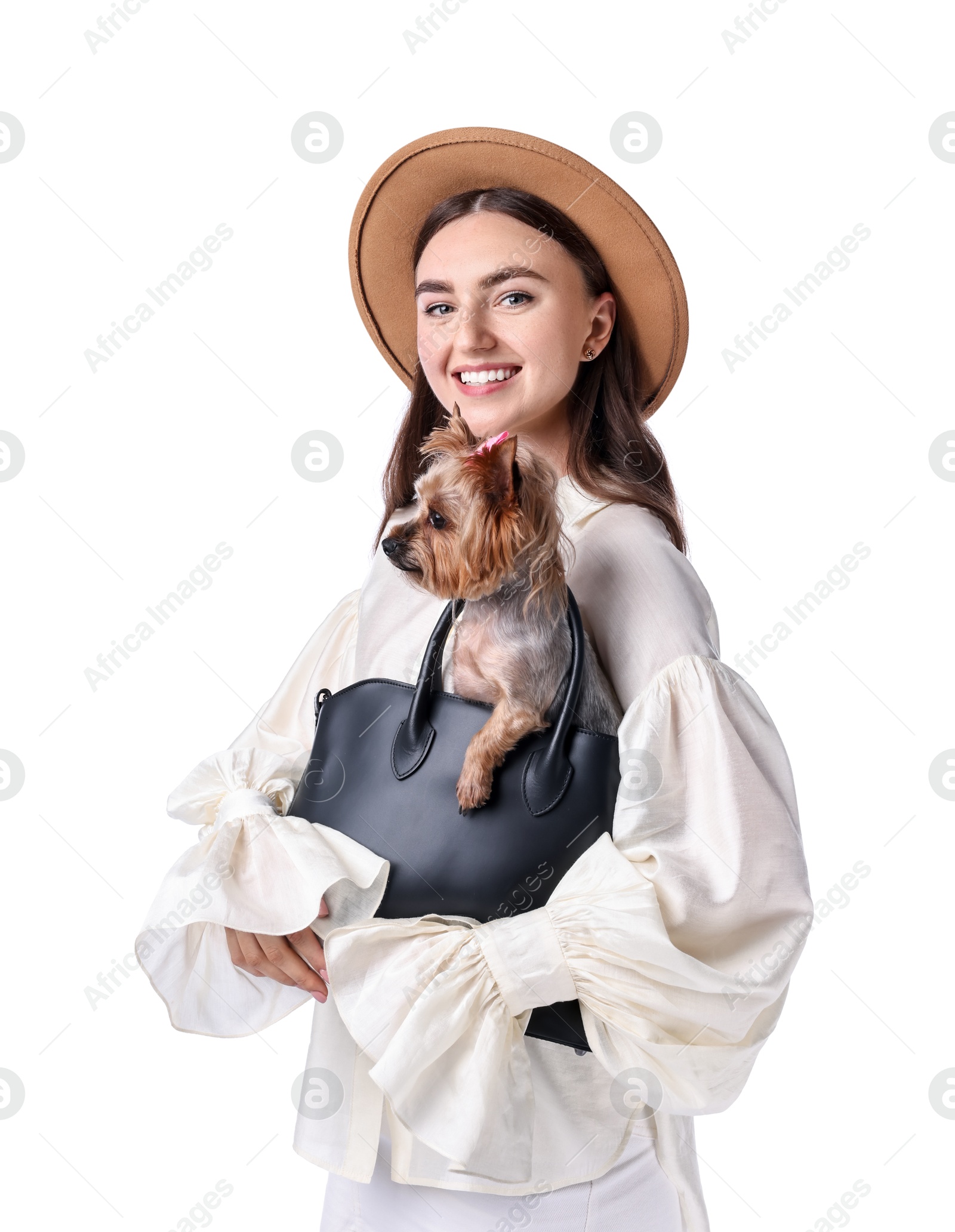 Photo of Beautiful young woman holding bag with cute Yorkshire Terrier dog isolated on white