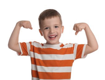 Cute little boy showing his biceps on white background