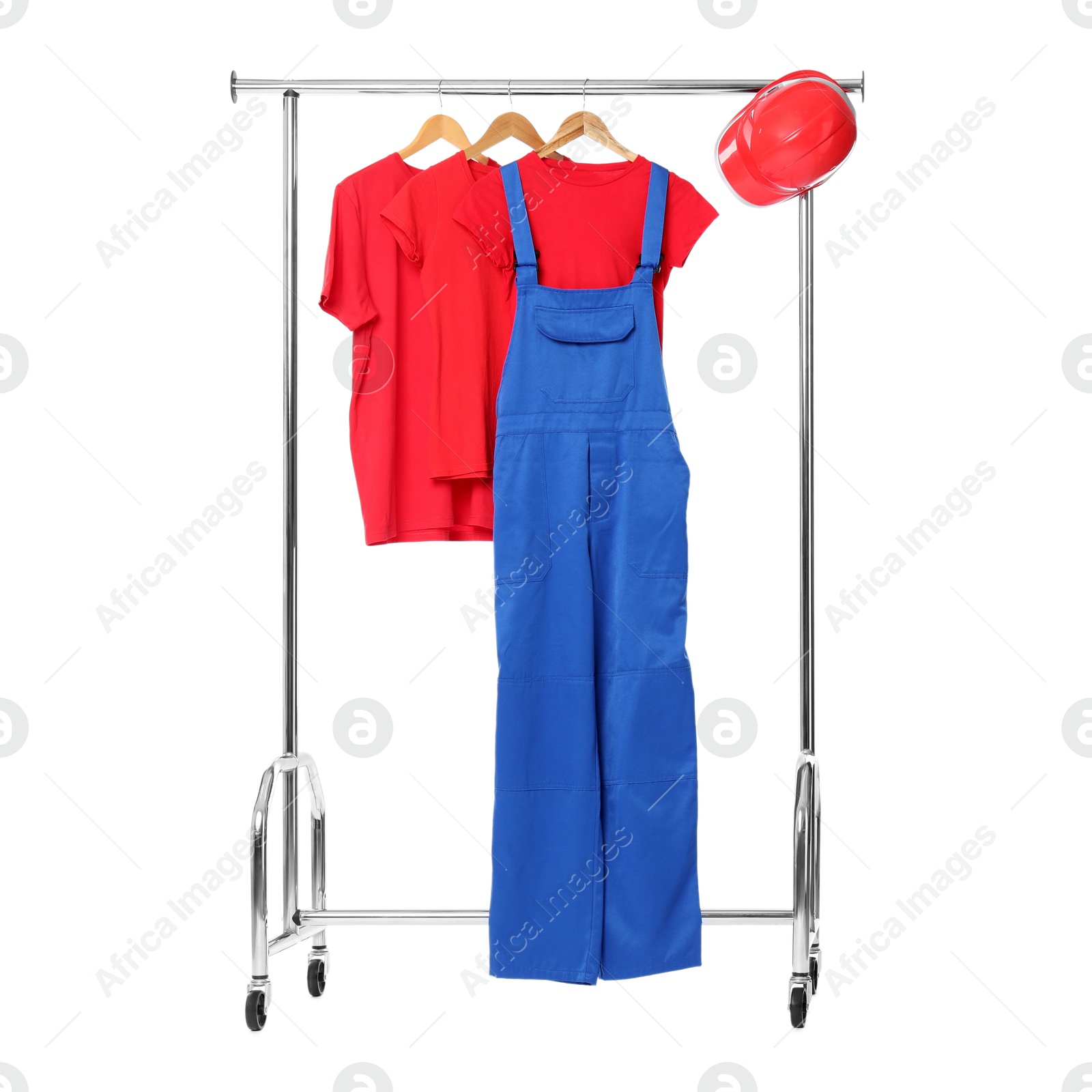 Photo of Worker's uniform and t-shirts on clothing rack isolated on white