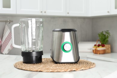 Photo of Blender kit on white marble table in kitchen