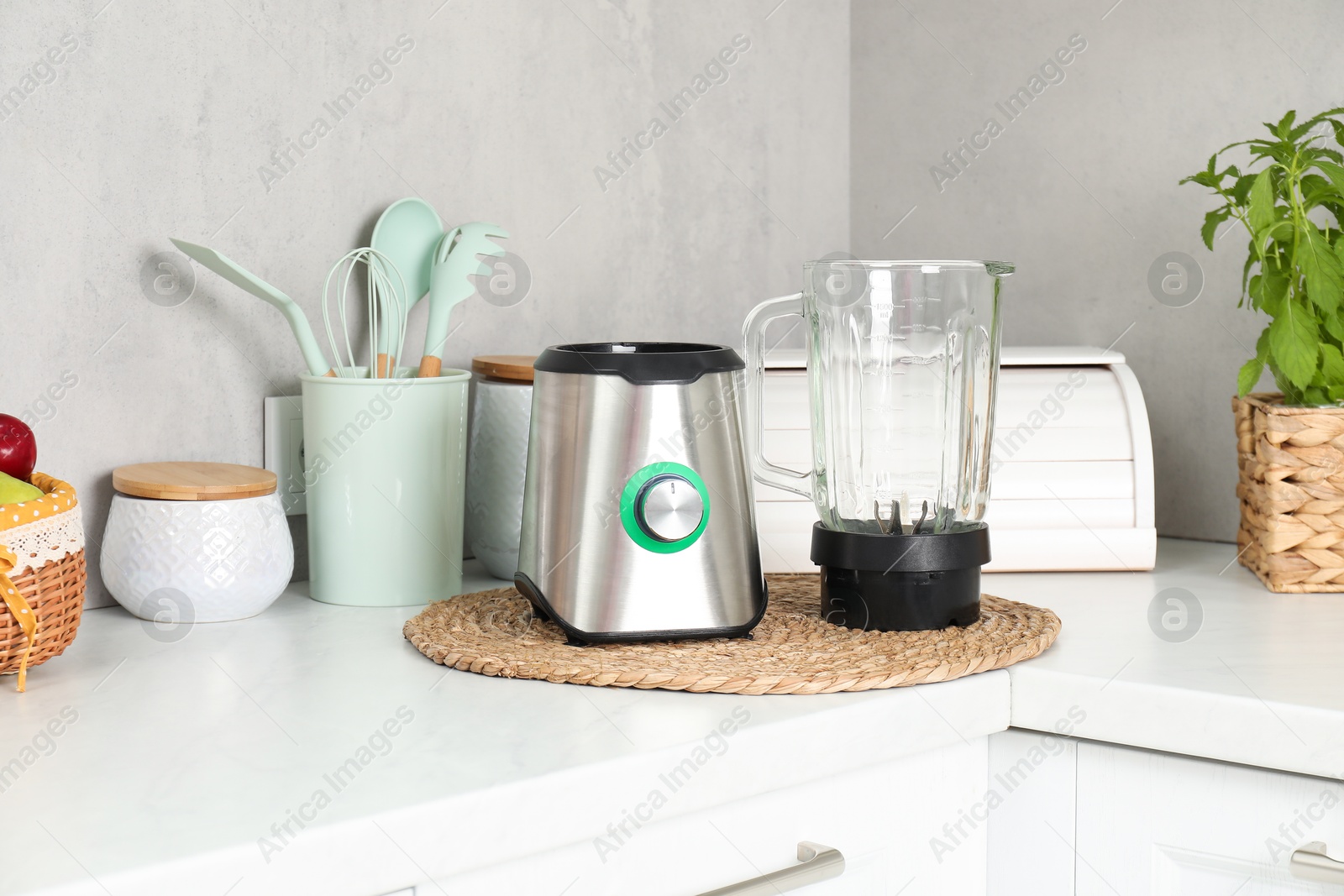 Photo of Blender kit on white marble countertop in kitchen