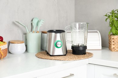 Photo of Blender kit on white marble countertop in kitchen