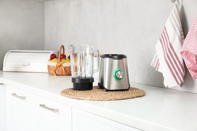 Photo of Blender kit on white marble countertop in kitchen