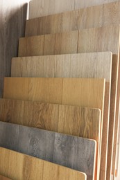 Photo of Many different samples of wooden flooring in store