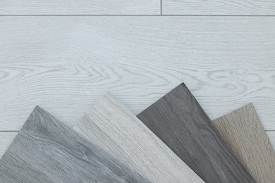 Photo of Different samples of wooden flooring indoors, top view