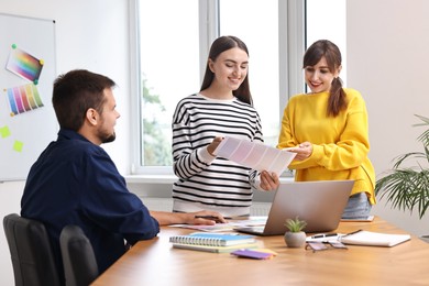 Group of designers working together in office