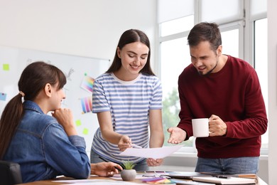 Group of designers working together in office