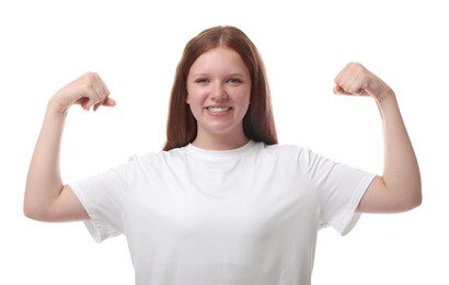 Photo of Teenage girl showing muscles on white background