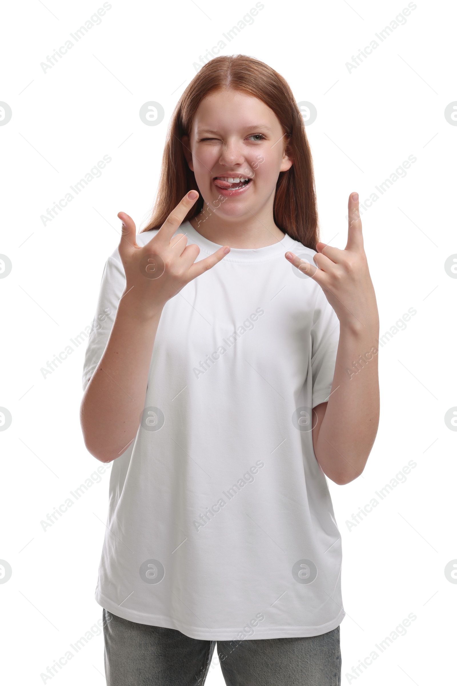 Photo of Teenage girl showing rock gesture on white background