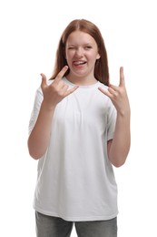 Teenage girl showing rock gesture on white background