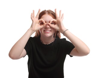 Photo of Cheerful teenage girl posing on white background