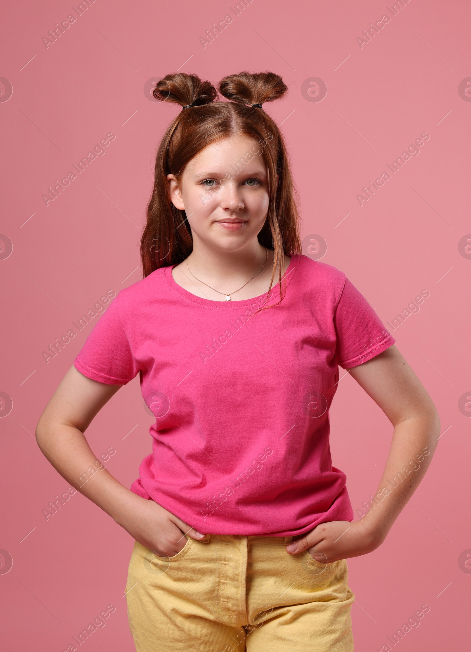 Photo of Portrait of teenage girl on pink background