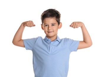 Photo of Cute little boy showing his biceps on white background